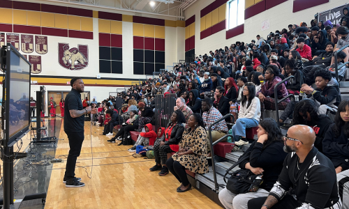  Dr. Tommie Mabry talks to Harding University High School students in the school's gym.